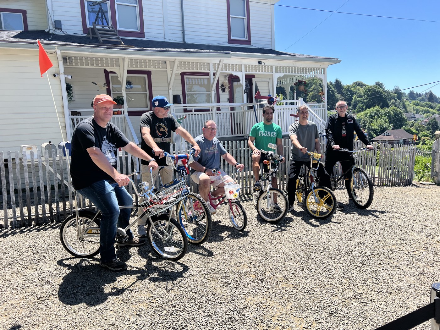 Goonies on BMX bikes in front of the house